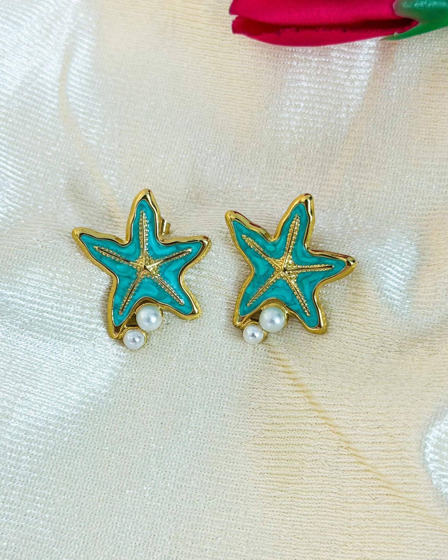 Blue starfish enamel earrings