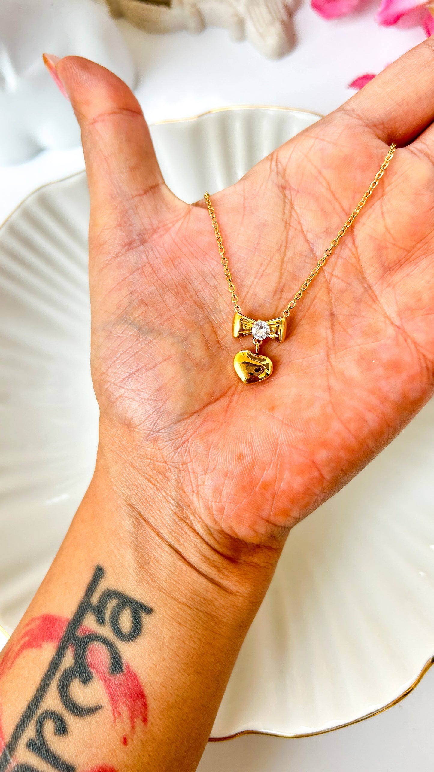 Studded bow heart necklace