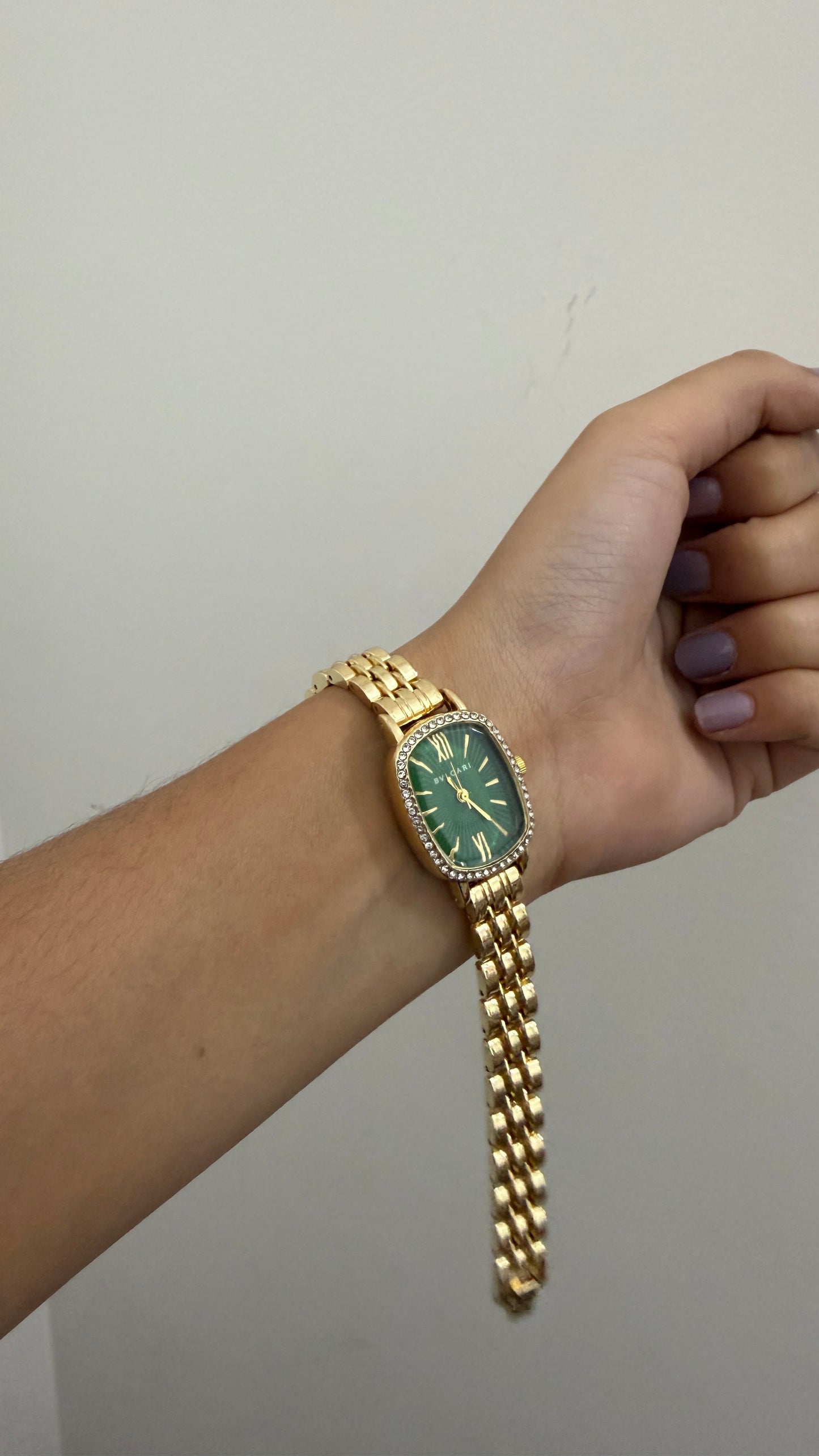 Studded Bvlgari square green dial watch