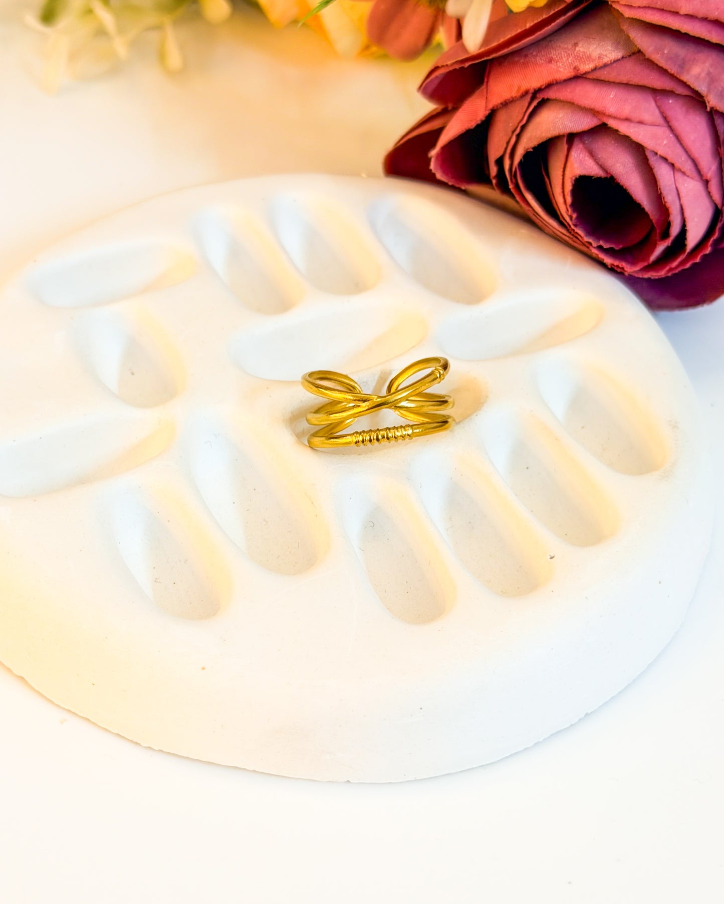 Cross layered adjustable ring