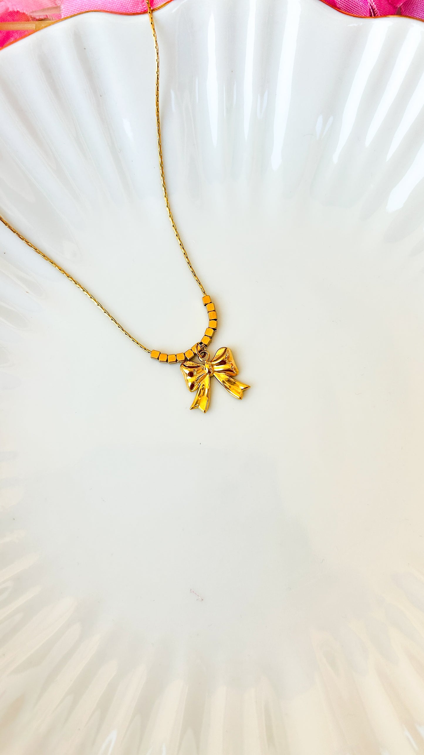 Beaded bow necklace