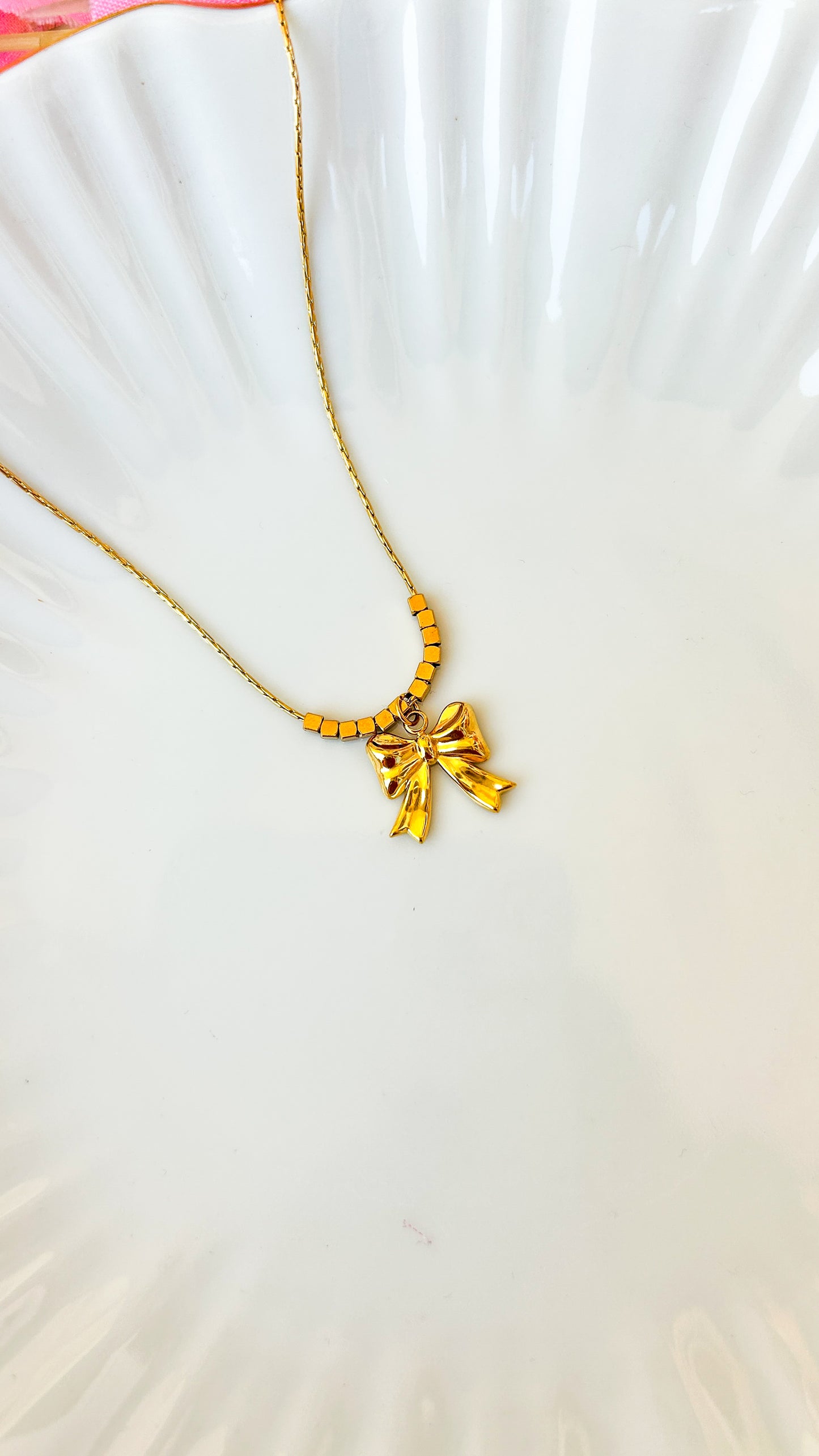 Beaded bow necklace