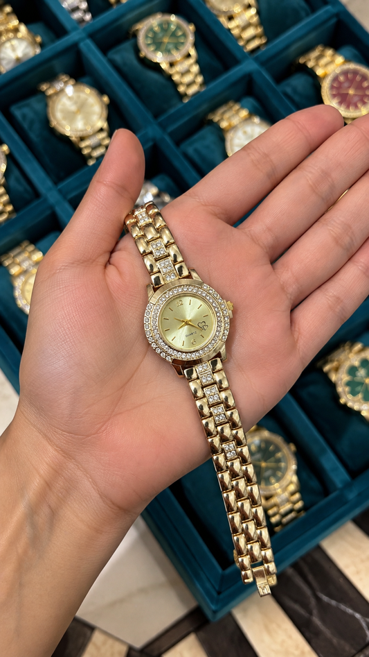 Golden round studded watch