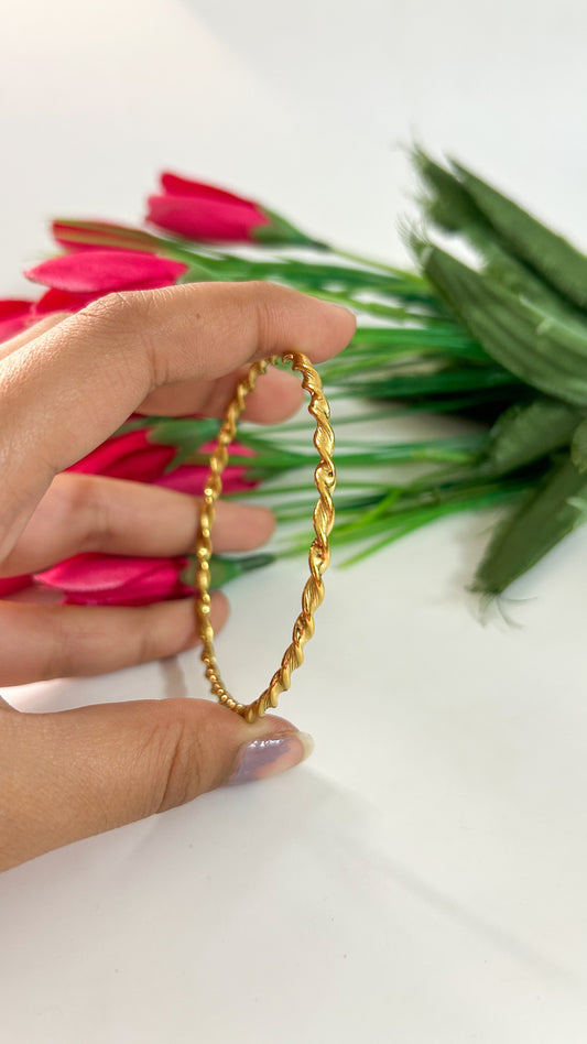 Golden twisted bracelet