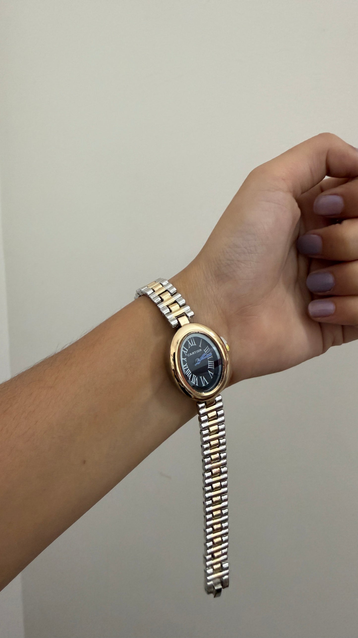 Cartier oval black dial watch