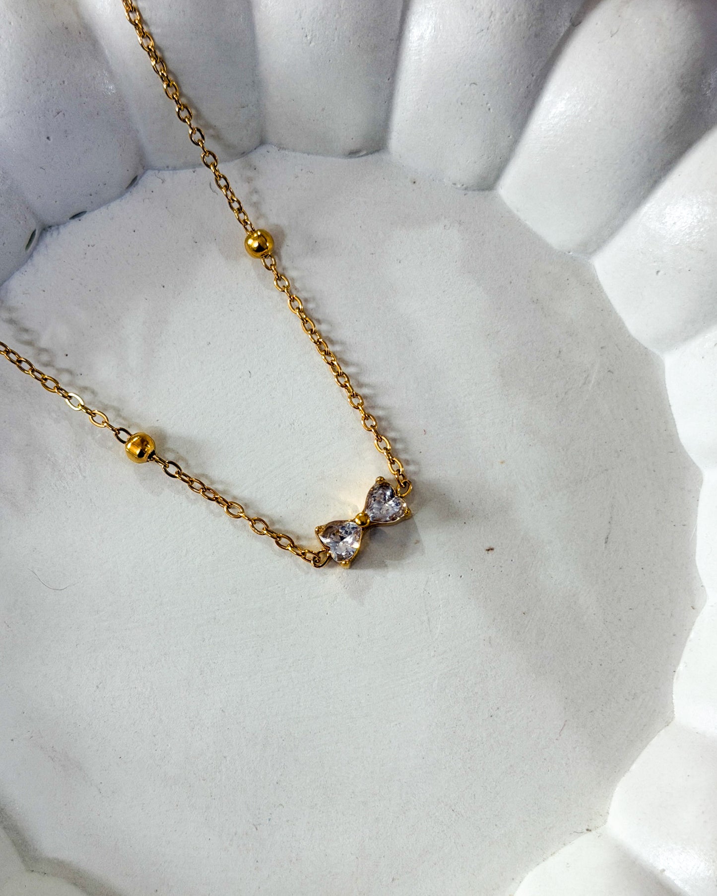 Mini studded bow necklace