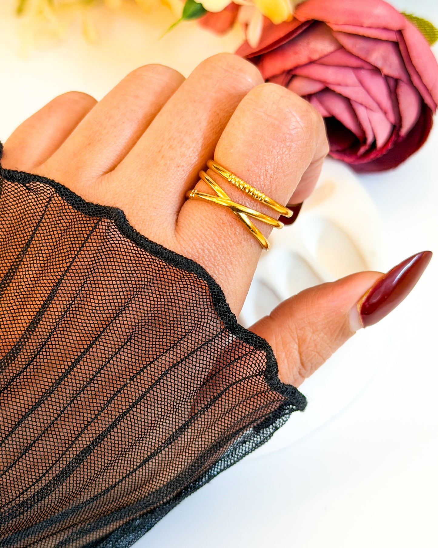 Cross layered adjustable ring