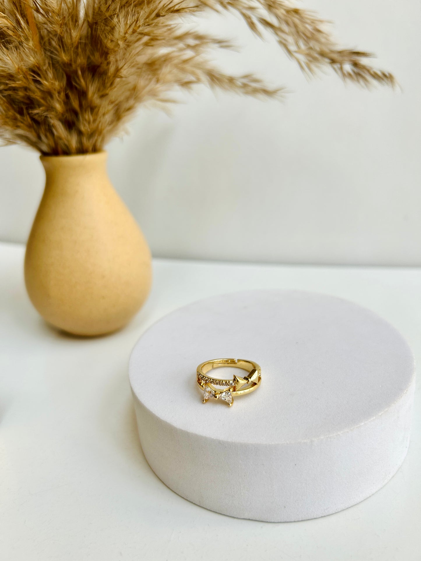 Studded bow adjustable ring