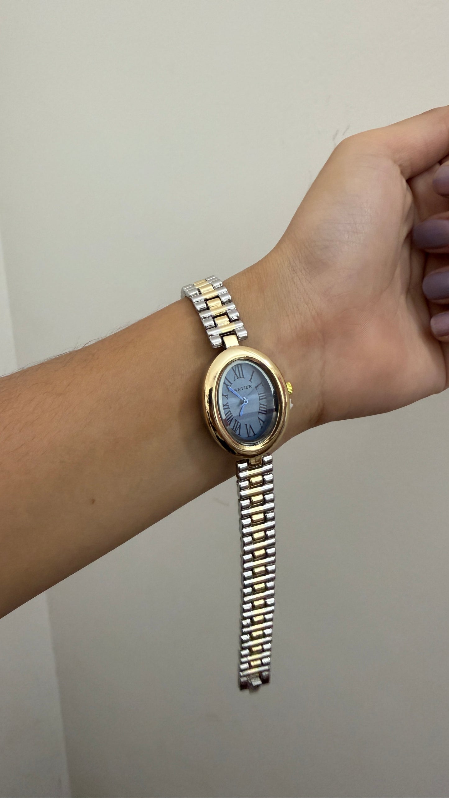 Cartier oval blue dial watch