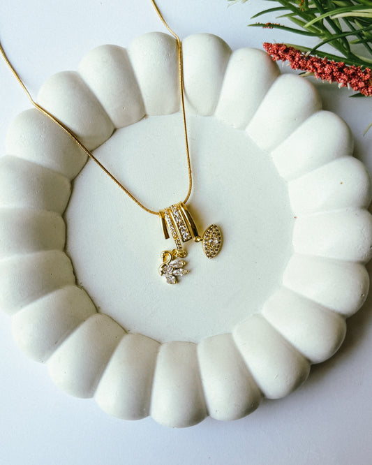 Studded bird eye charm necklace