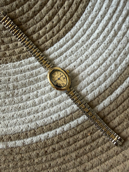 Cartier oval gold dial watch