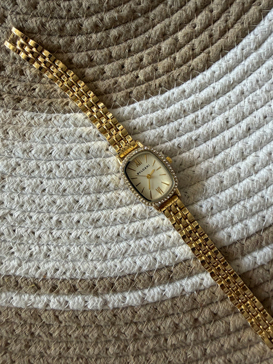 Studded Bvlgari square white dial watch