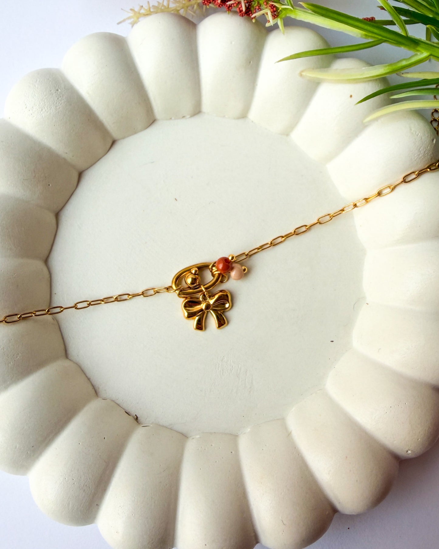 Bow charm necklace