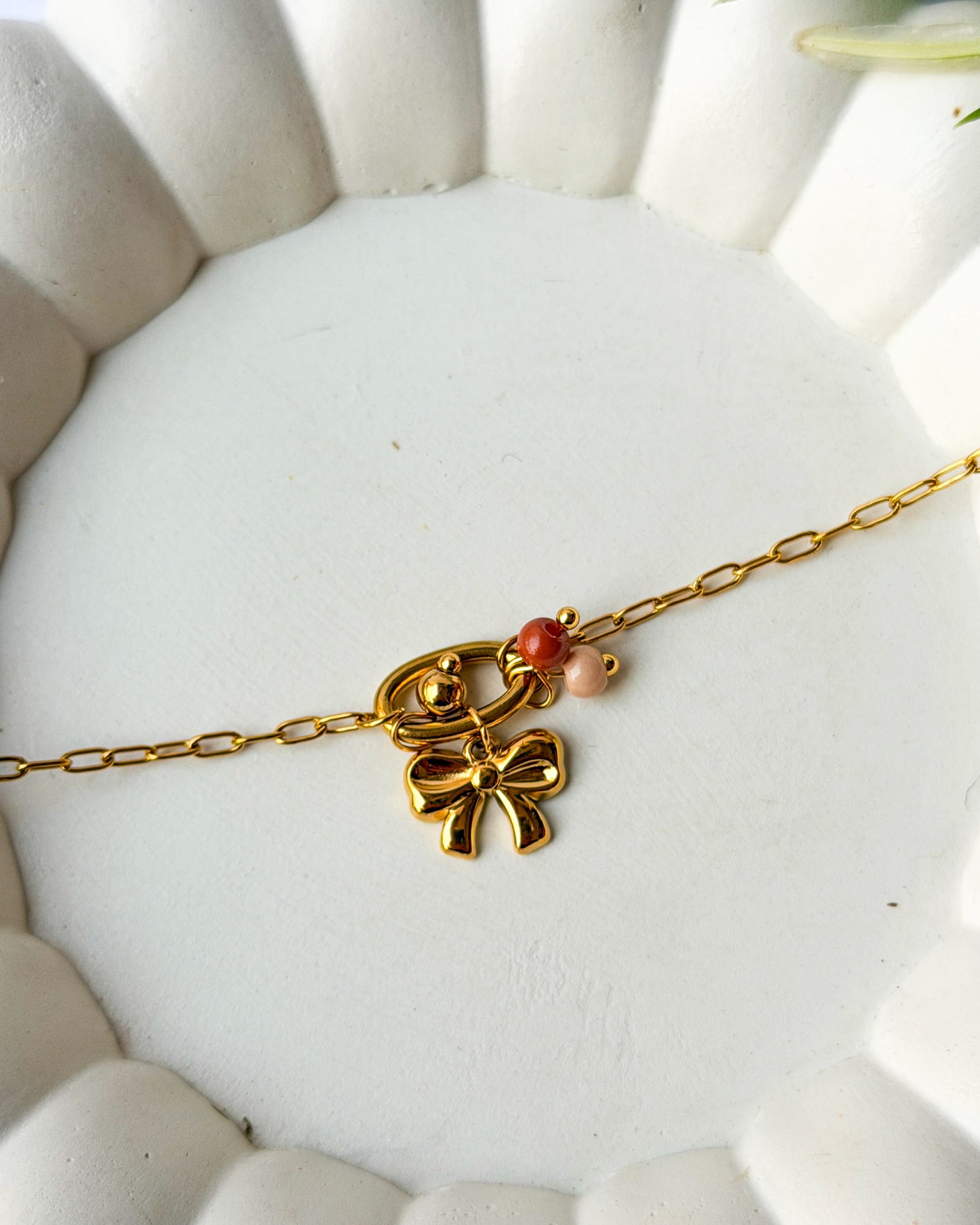 Bow charm necklace