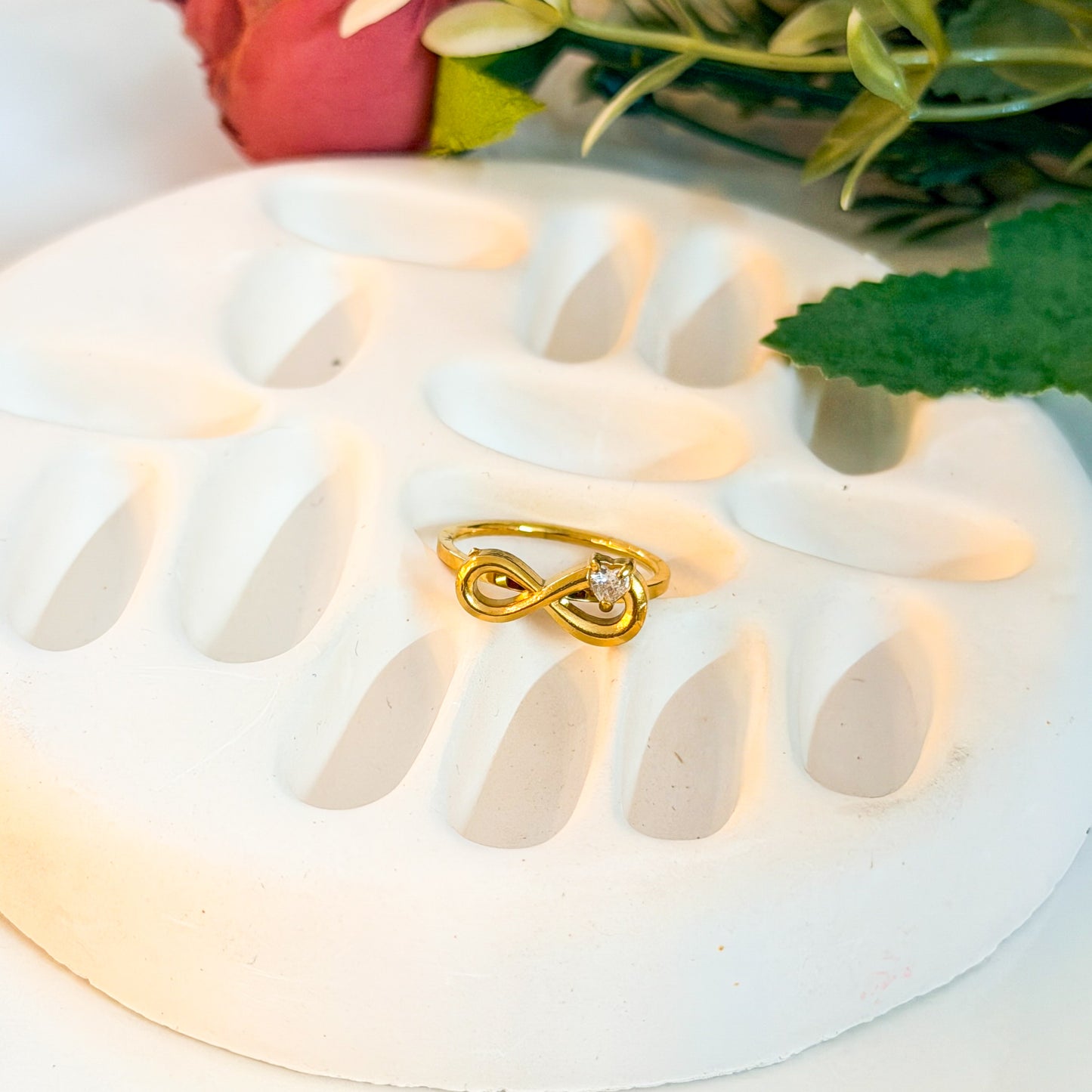 Infinity ring with heart stone detailing