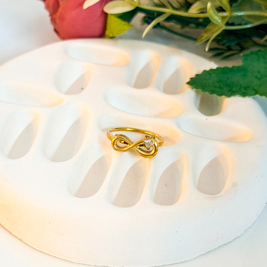 Infinity ring with heart stone detailing
