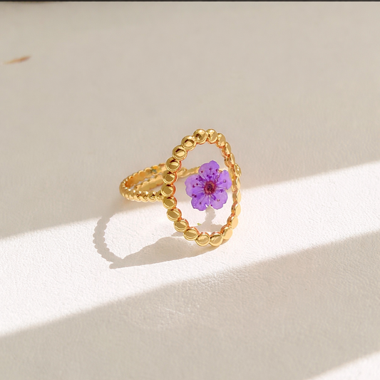 Oval shape with purple floral resin ring