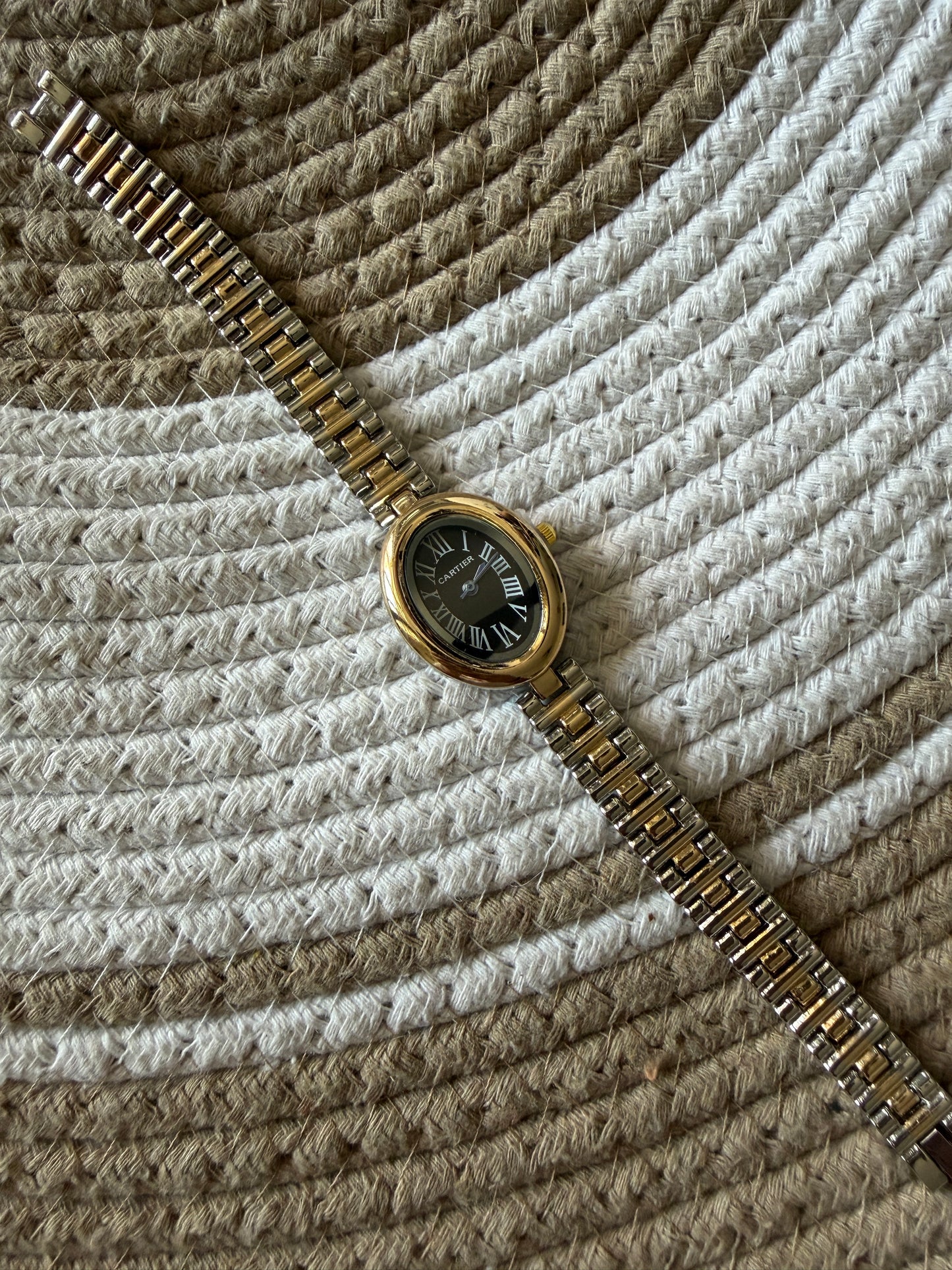 Cartier oval black dial watch