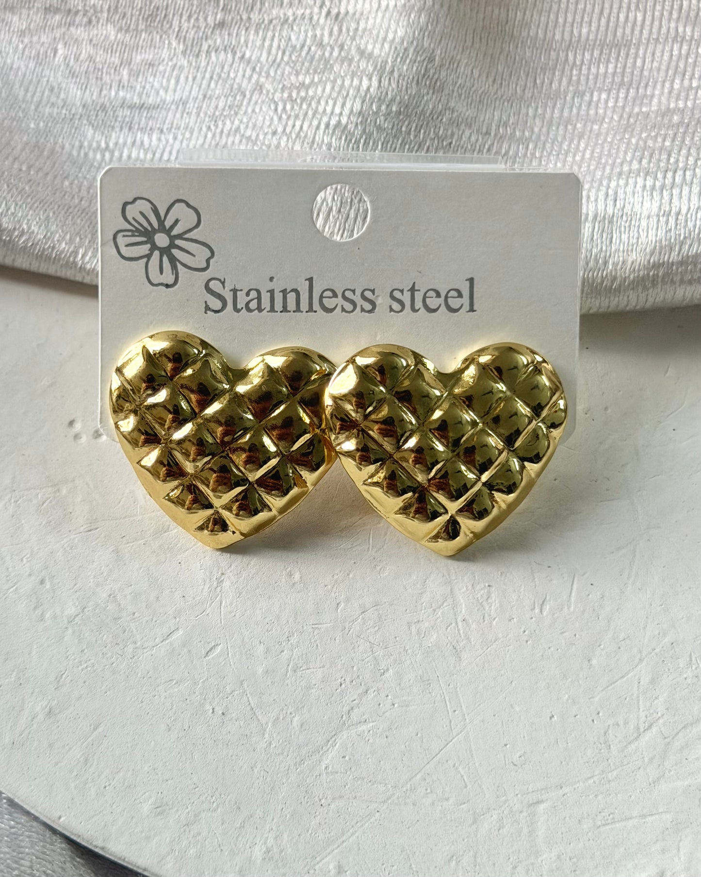 Crisscross heart statement earrings